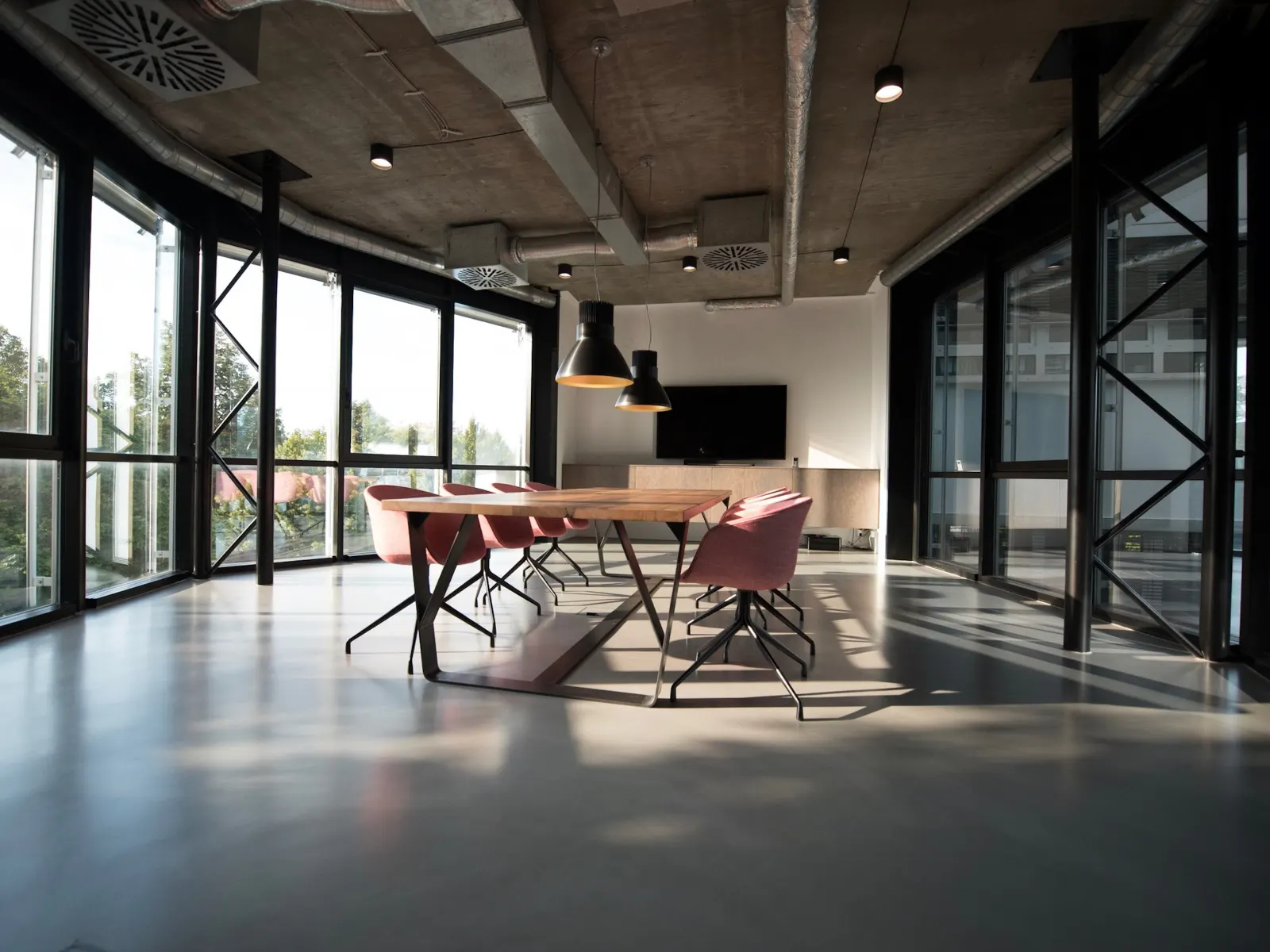 An empty open office floor with desks ready for product work.